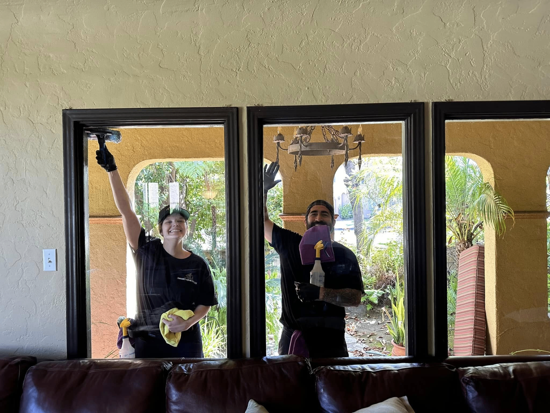 Swanky Home Services team cleaning windows